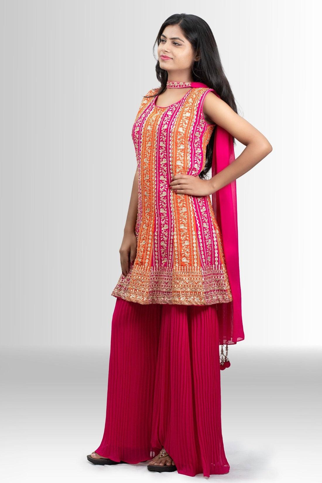 Rani pink and orange embroidered peplum sharara outfit — featured in Rosio House blog post: Haldi Outfit Ideas 2026: What to Wear as Bride, Family & Guest