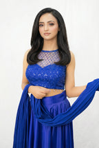 Side view of the modern Indo-western blue lehenga set, highlighting the sleeveless design and the elegant drape of the skirt.