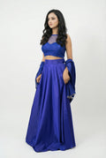 Side view of the modern Indo-western blue lehenga set, highlighting the sleeveless design and the elegant drape of the skirt.