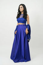 Side view of the modern Indo-western blue lehenga set, highlighting the sleeveless design and the elegant drape of the skirt.