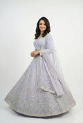 Full view of the lavender bridal lehenga set on a mannequin, featuring heavy white bead and sequin handwork embroidery.