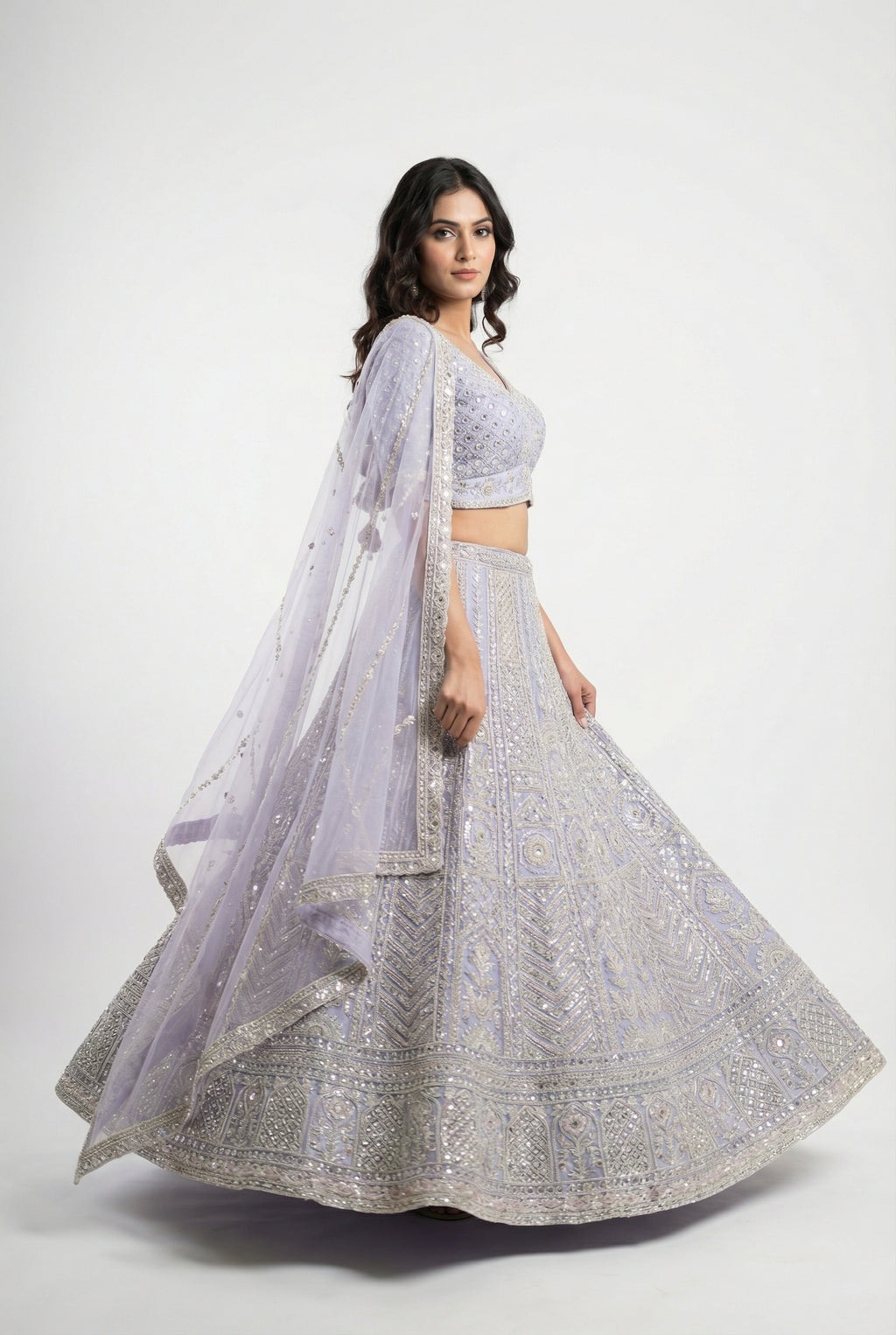 Detail shot of the V-neck blouse showing the dense full sequin and bead embroidery matching the lehenga.