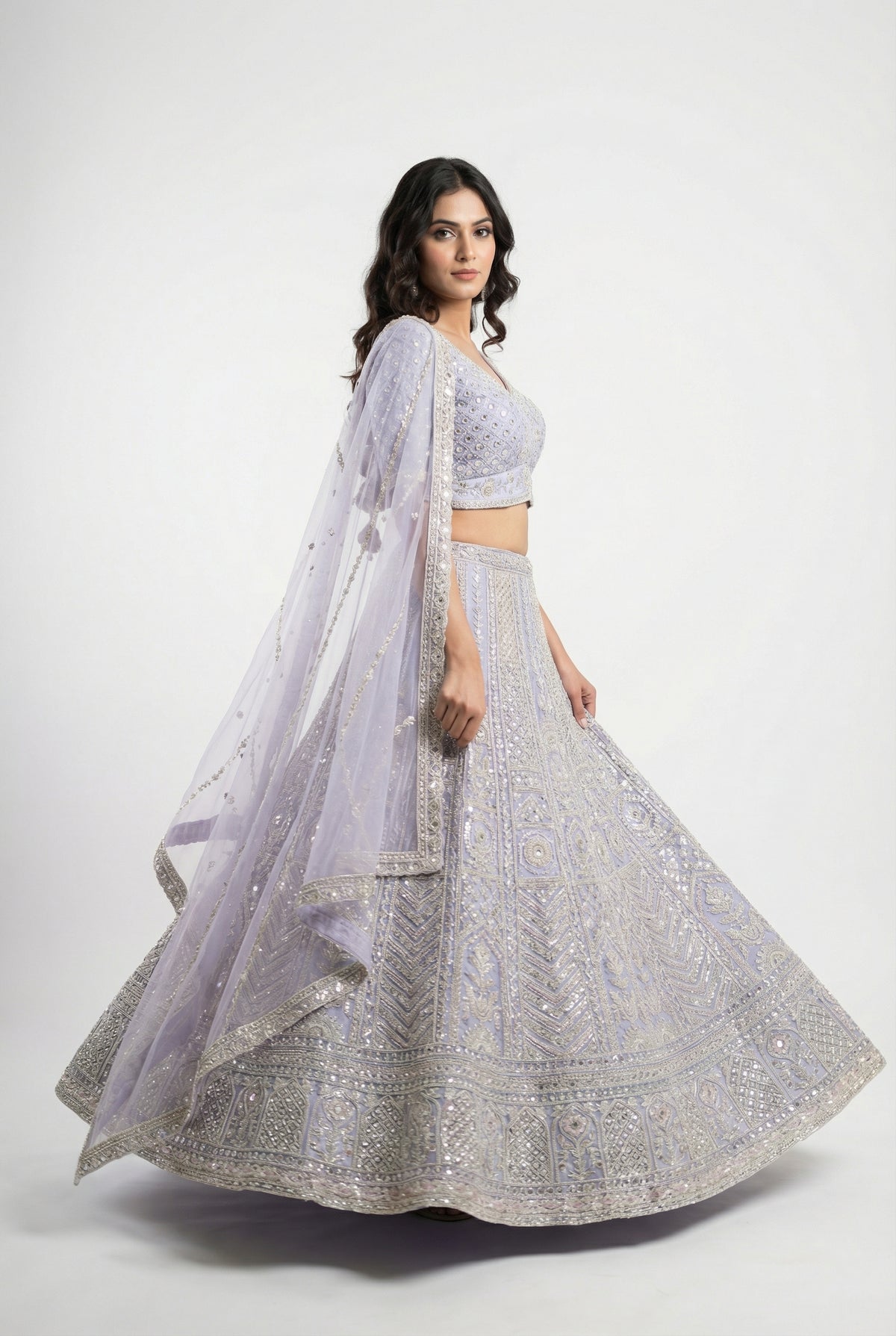 Detail shot of the V-neck blouse showing the dense full sequin and bead embroidery matching the lehenga.