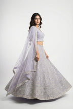 Detail shot of the V-neck blouse showing the dense full sequin and bead embroidery matching the lehenga.