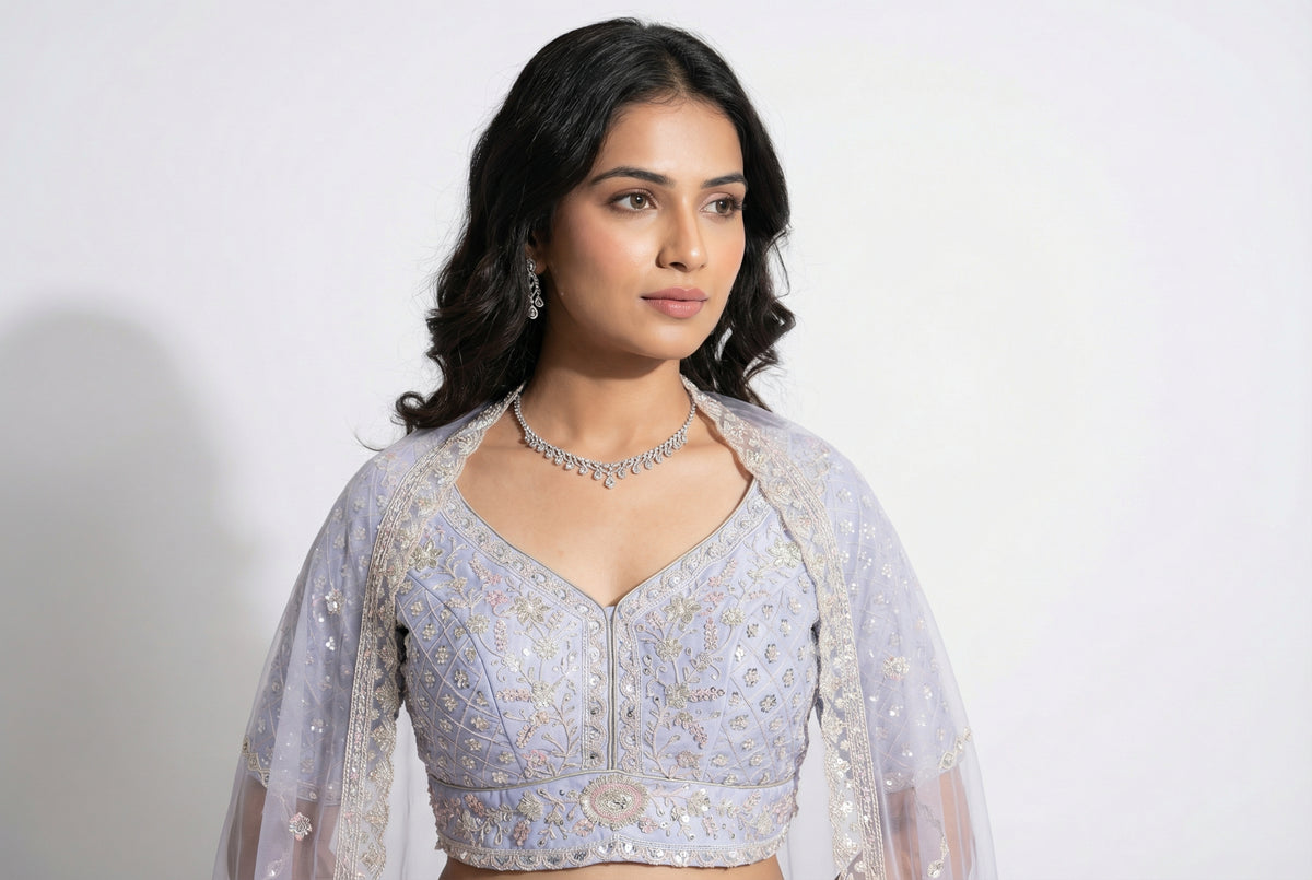 A complete view of the heavy pastel purple lehenga set, showcasing the flared silhouette perfect for an Indian wedding reception.