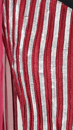 Close-up of red and silver striped fabric of maroon crop top