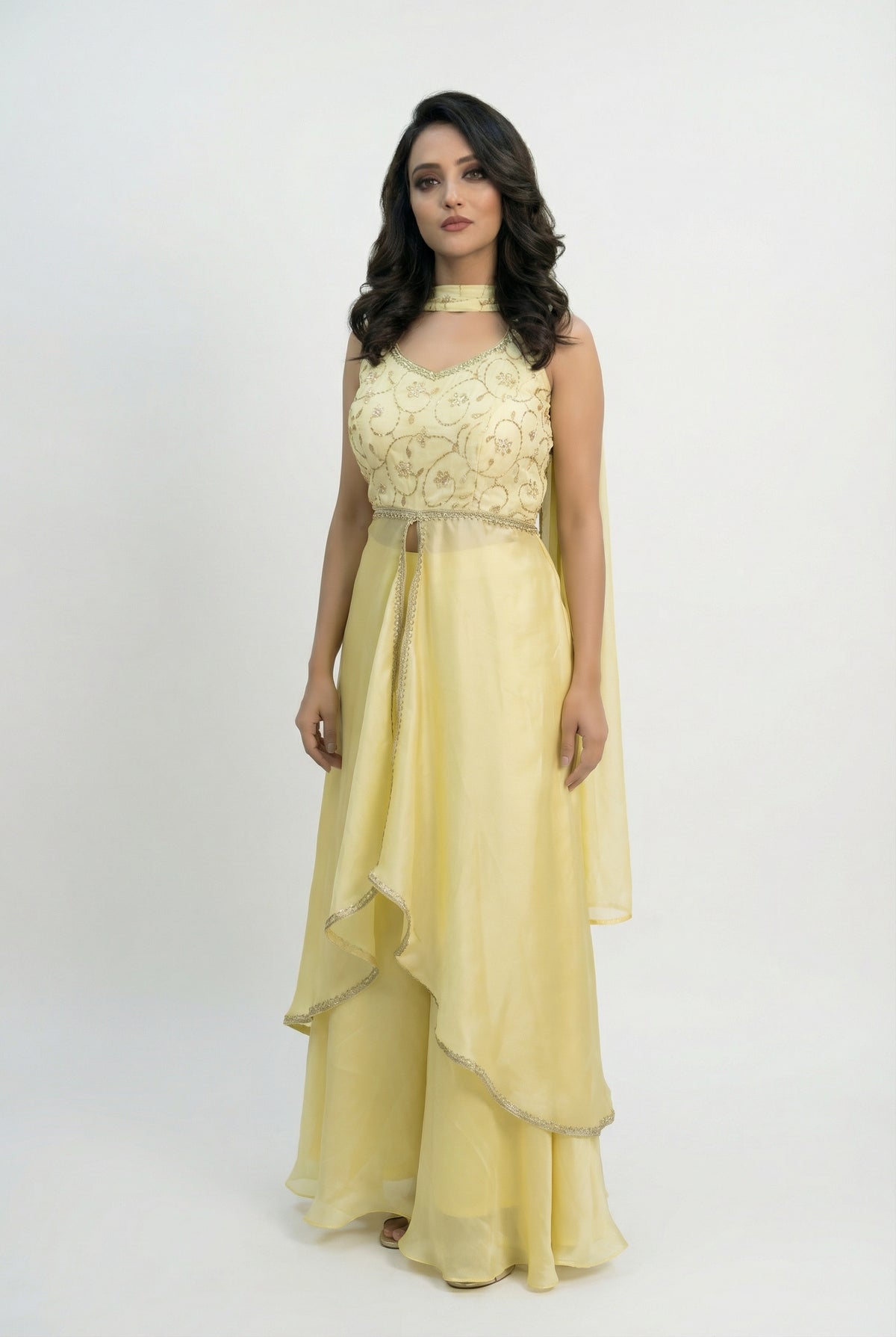A stylish pose showing the complete yellow fusion outfit, perfect for a modern bride or guest at a Haldi ceremony.