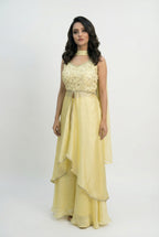 A stylish pose showing the complete yellow fusion outfit, perfect for a modern bride or guest at a Haldi ceremony.