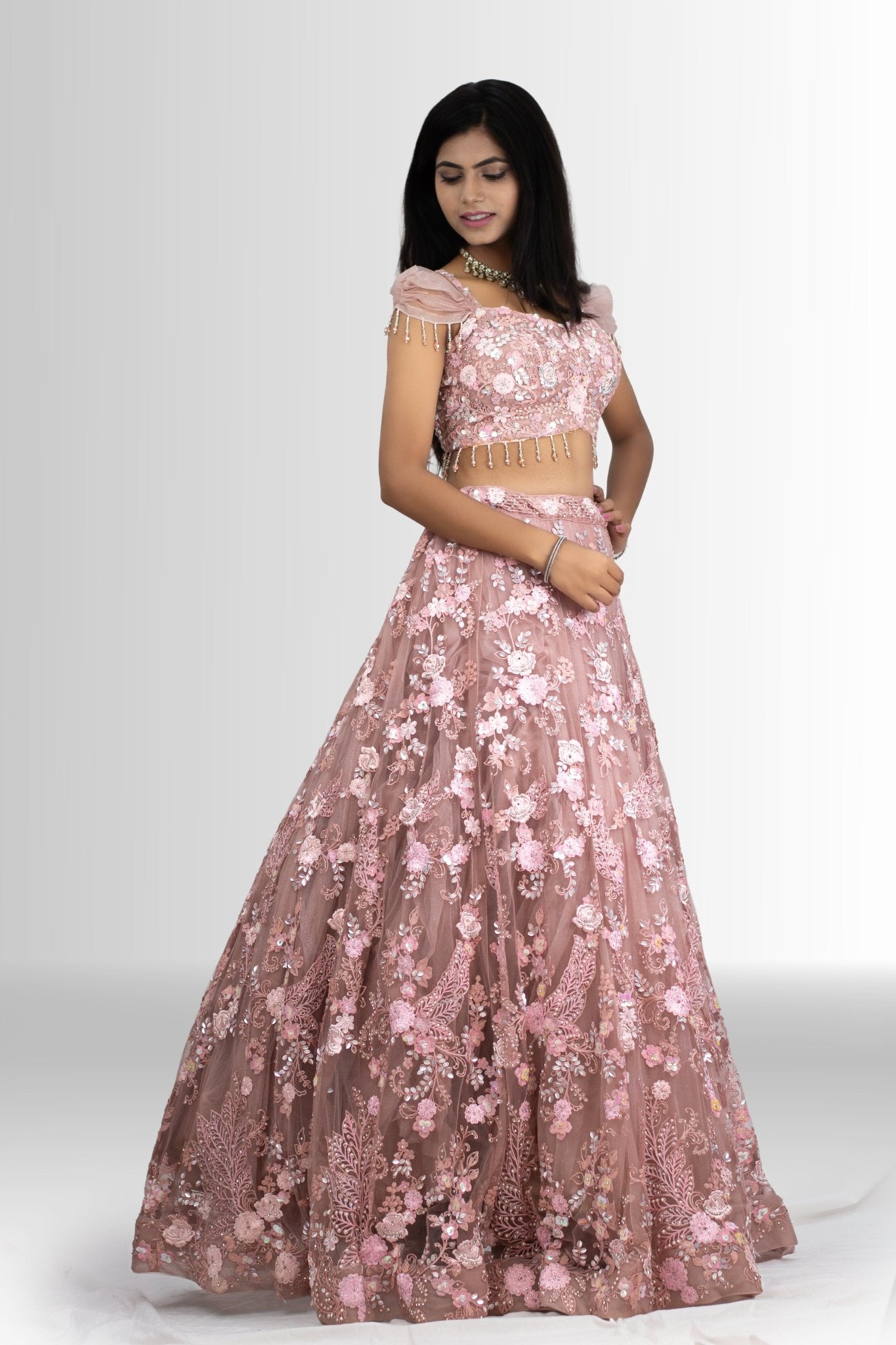 Blush Bloom lehenga set featuring intricate handwork and floral motifs