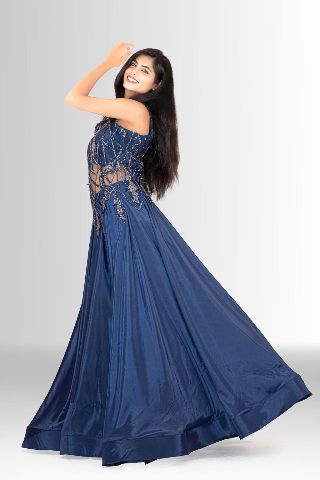Detail shot of the lustrous navy blue satin skirt fabric, showing its subtle sheen and texture.