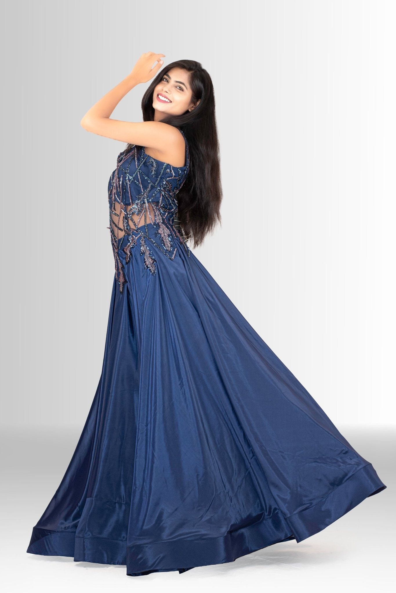 Detail shot of the lustrous navy blue satin skirt fabric, showing its subtle sheen and texture.