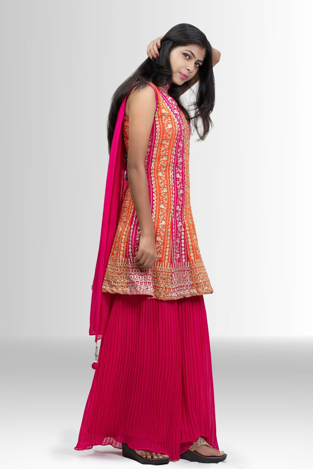 Embroidered Peplum Sharara outfit in Rani Pink & Orange