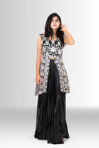 Detailing of black satin skirt paired with embroidered jacket Rosio House