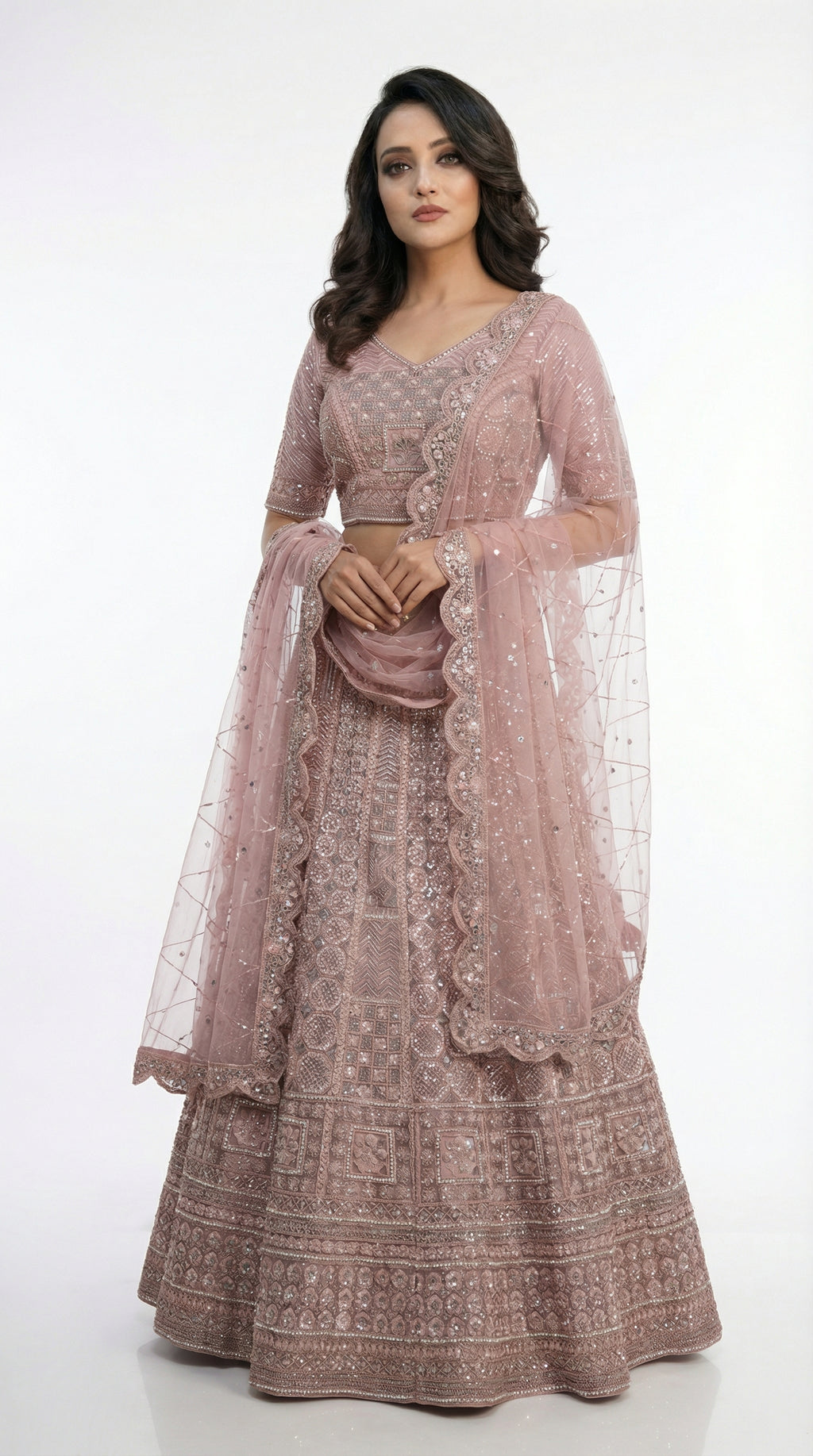 Detail shot of the matching mauve blouse featuring heavy silver sequin and thread embroidery with a classic neckline.