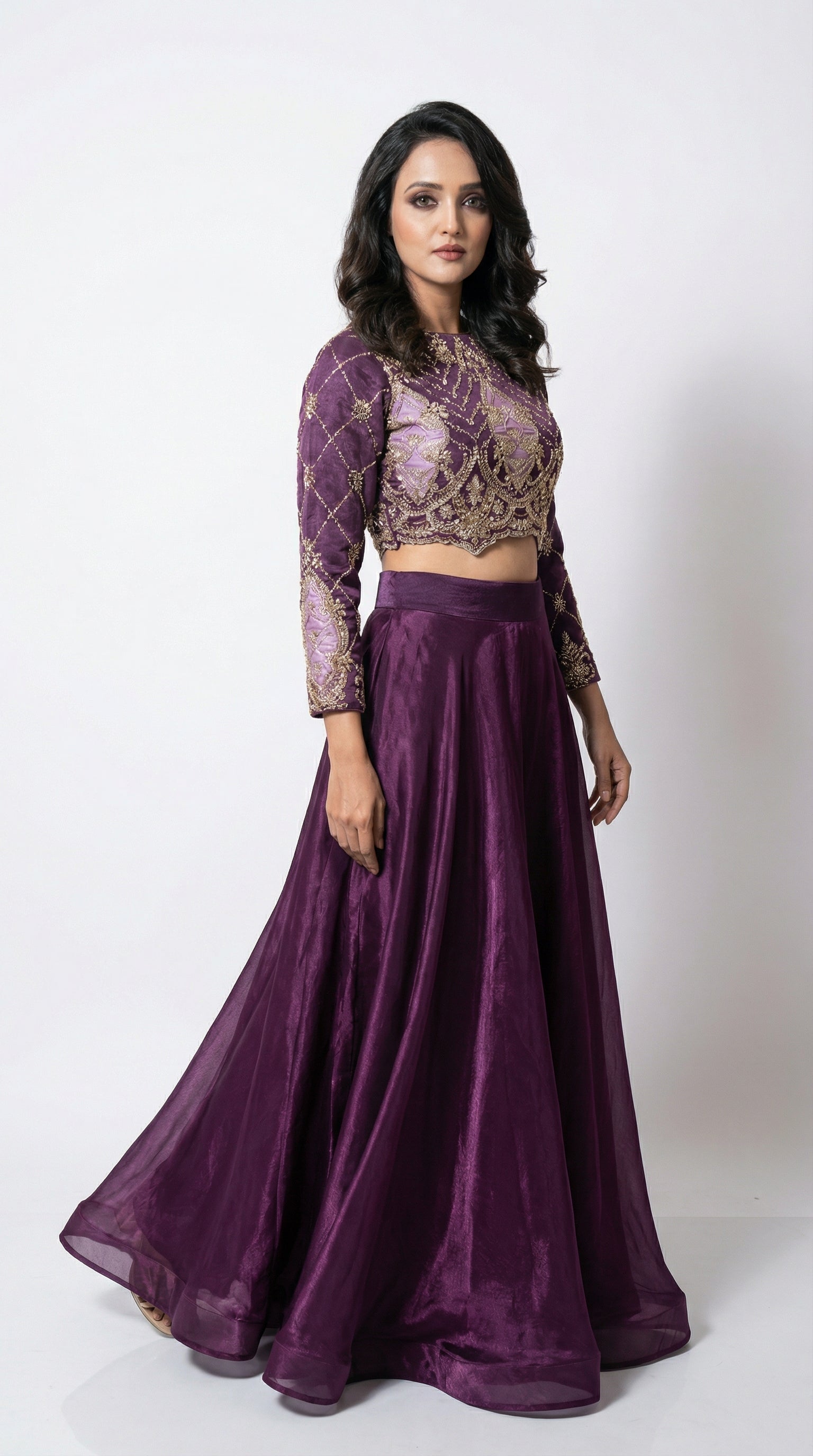 Close-up of the back of the purple crop top, showcasing the stylish large fabric bow and keyhole cutout detail.