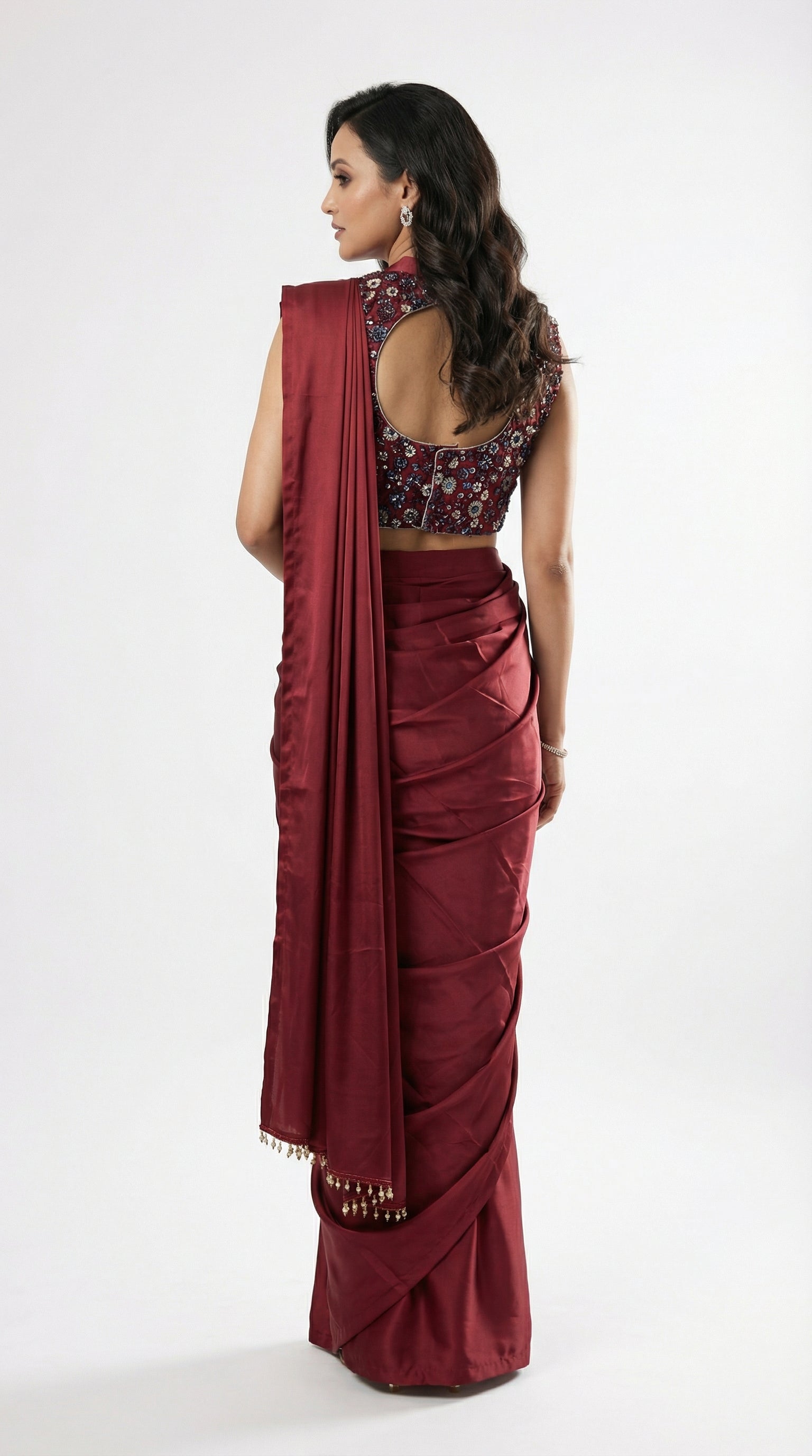Full body front view of the Rosio House maroon satin drape saree set featuring a high-neck floral blouse.