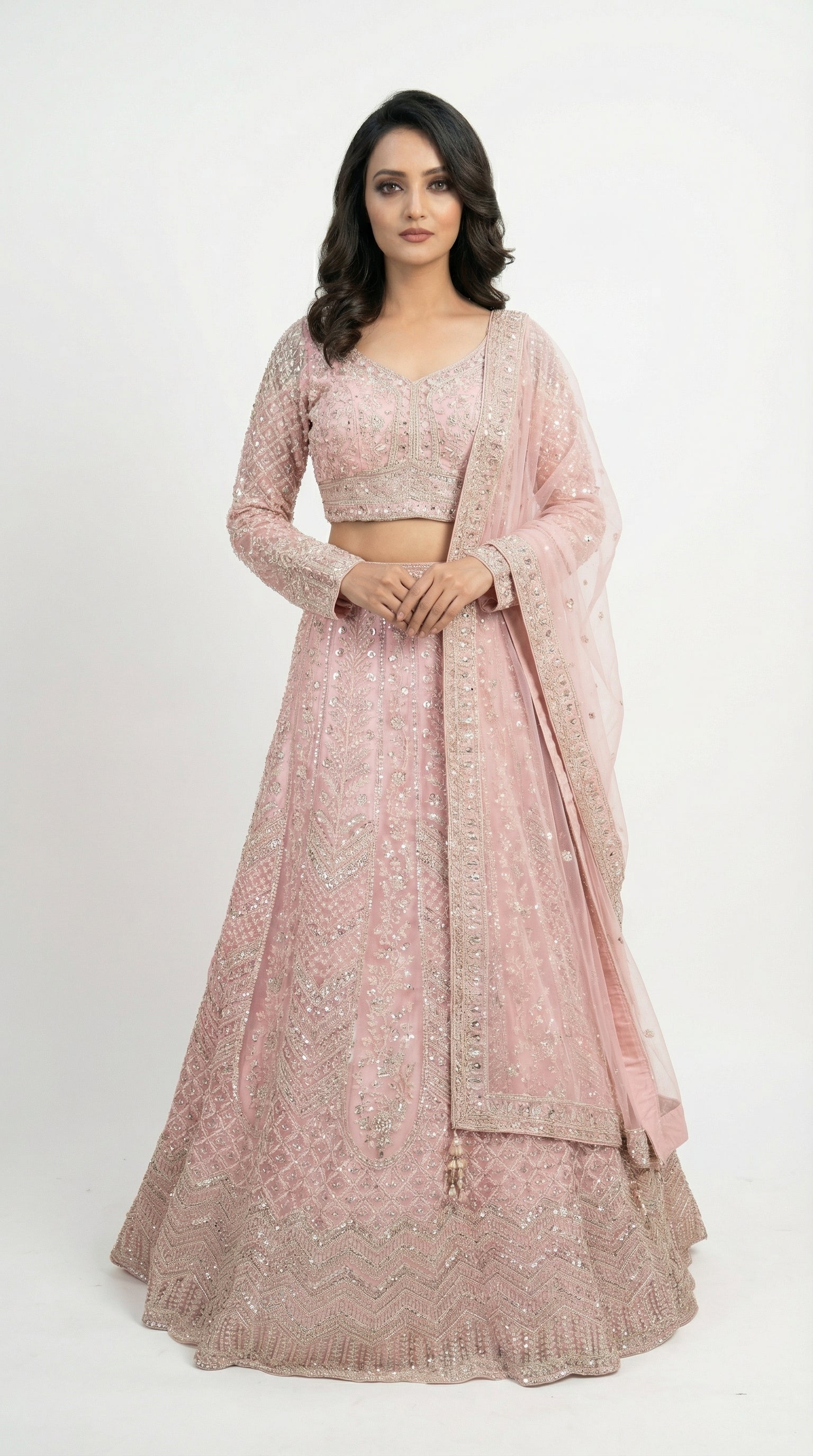 Woman wearing a pink traditional outfit with a white background