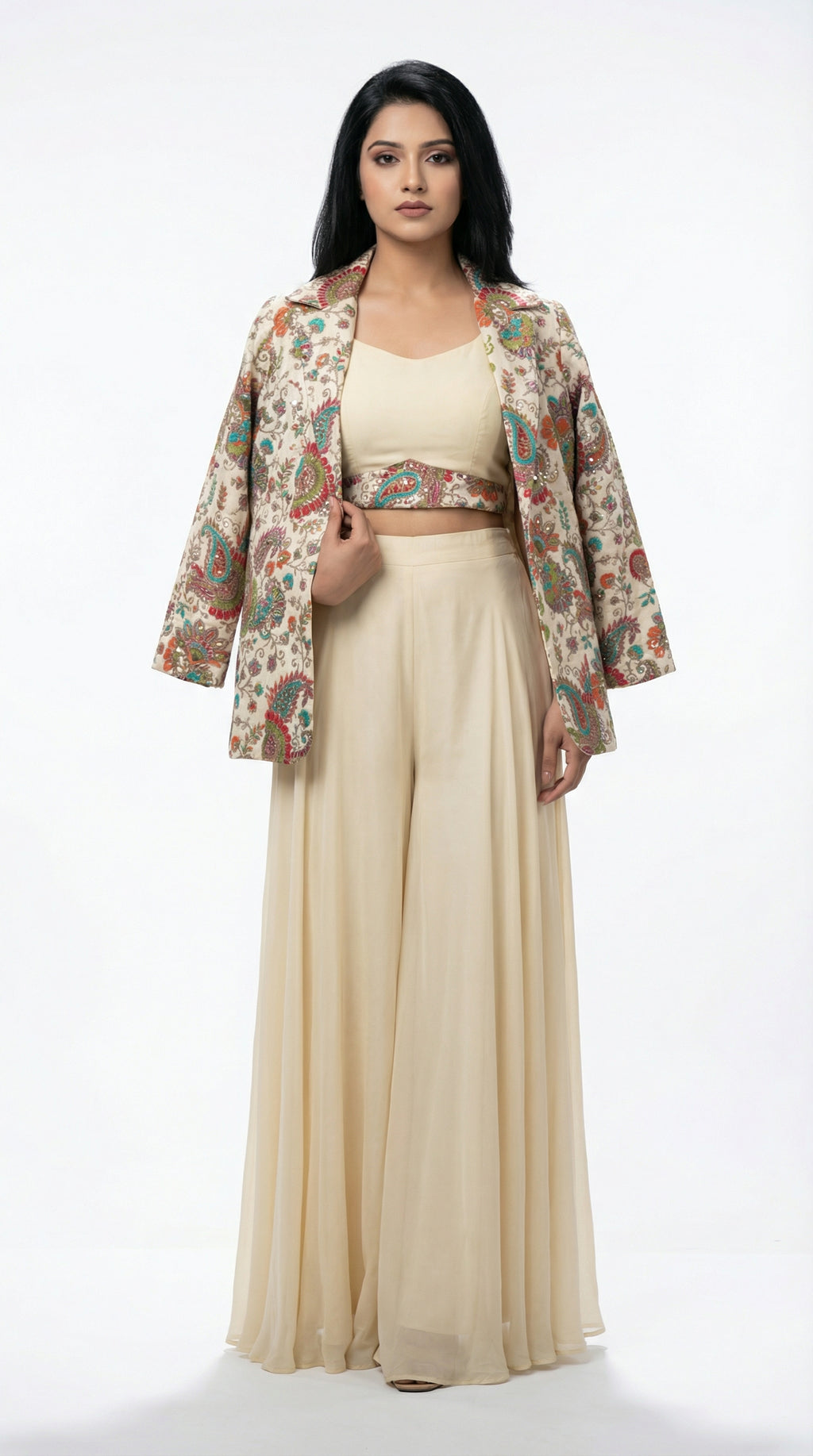 A view showing the solid off-white inner crop top layered under the printed blazer, highlighting the modern neckline.