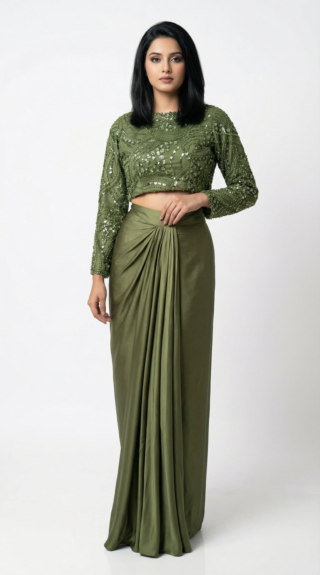 Woman wearing a green sequined top and skirt set on a white background