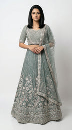 Women wearing green handwork lehenga with hand embroidery for wedding and sider lehenga