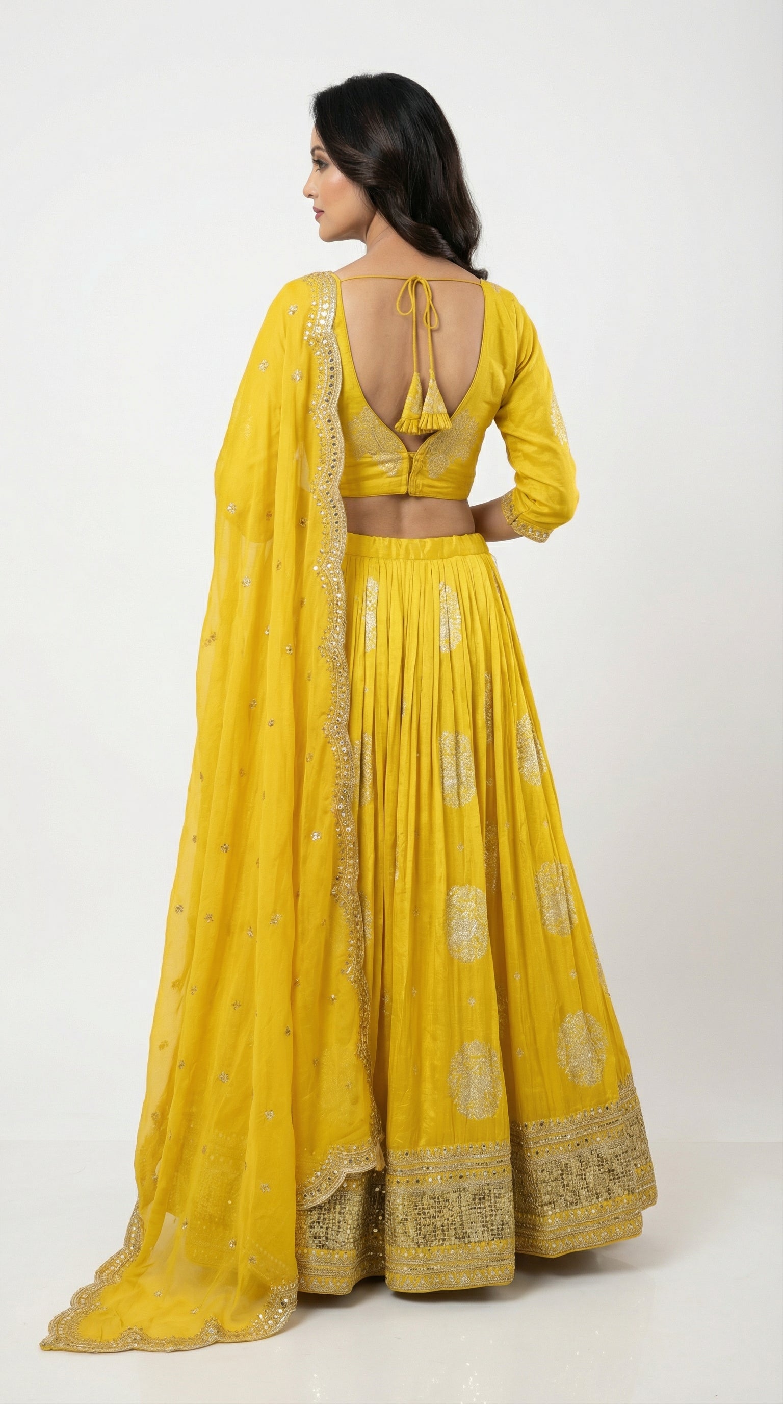 Women wearing banasri yellow lehenga