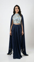 A view of the long sheer navy blue shrug, highlighting the delicate tassel details on the hemline.