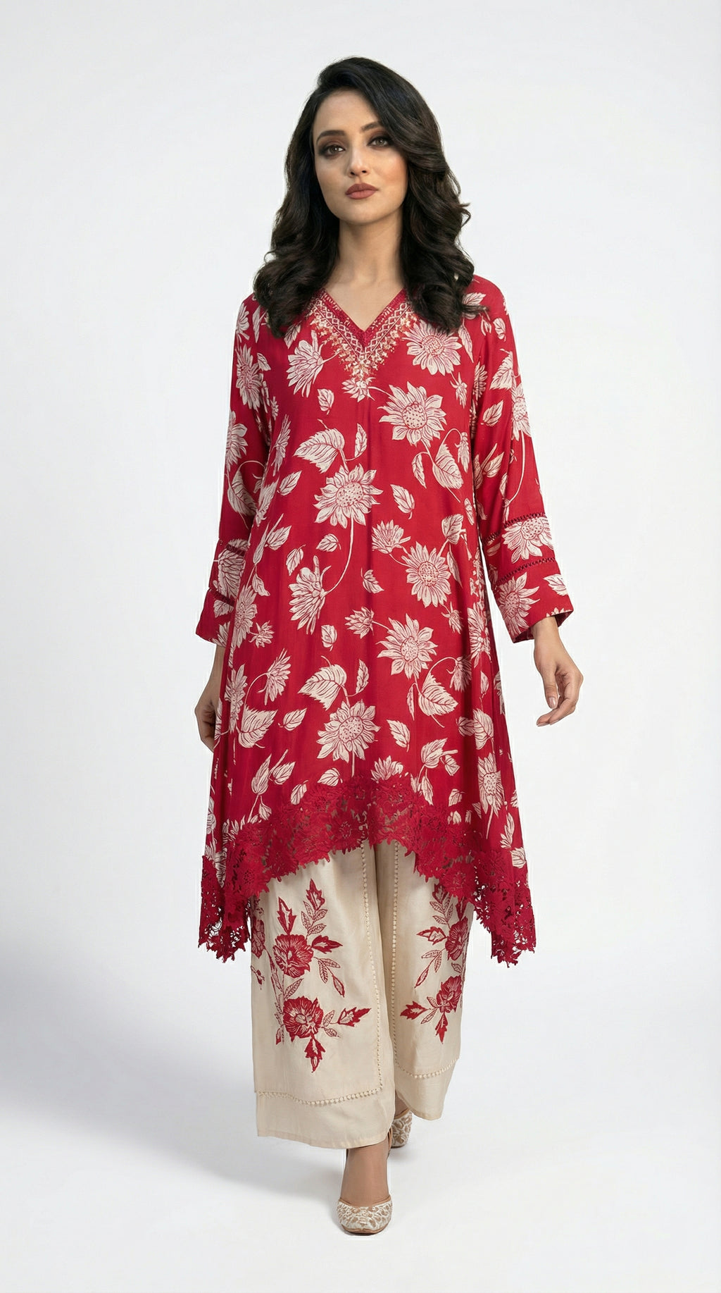 Full body front view of the Rosio House red kaftan style kurta with floral print paired with beige embroidered palazzo pants.