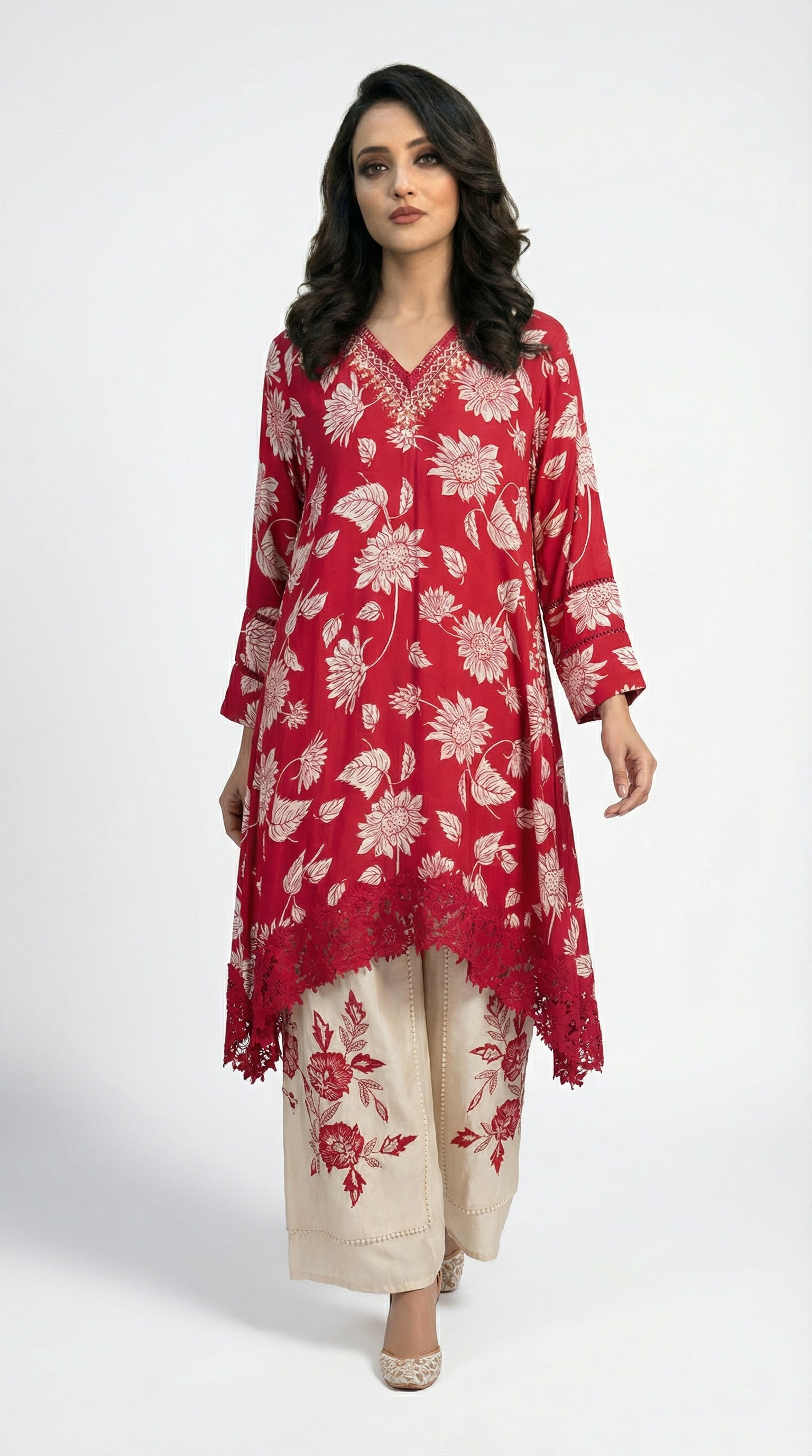 Full body front view of the Rosio House red kaftan style kurta with floral print paired with beige embroidered palazzo pants.