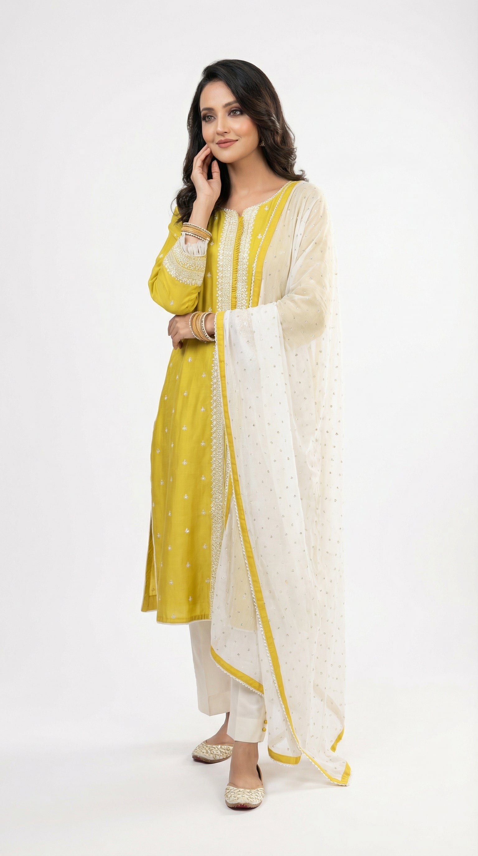 Detail shot of the 3/4 sleeves showing the white embroidery and trendy fringe tassel lace on the cuffs.