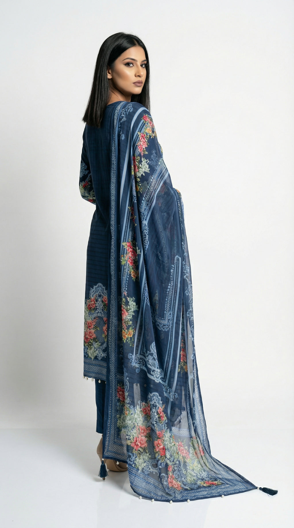 Detail shot showing the smooth, flowy texture of the imported crepe fabric and the intricate geometric border print.