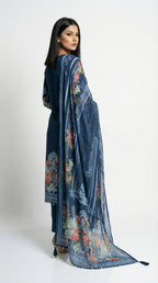 Detail shot showing the smooth, flowy texture of the imported crepe fabric and the intricate geometric border print.