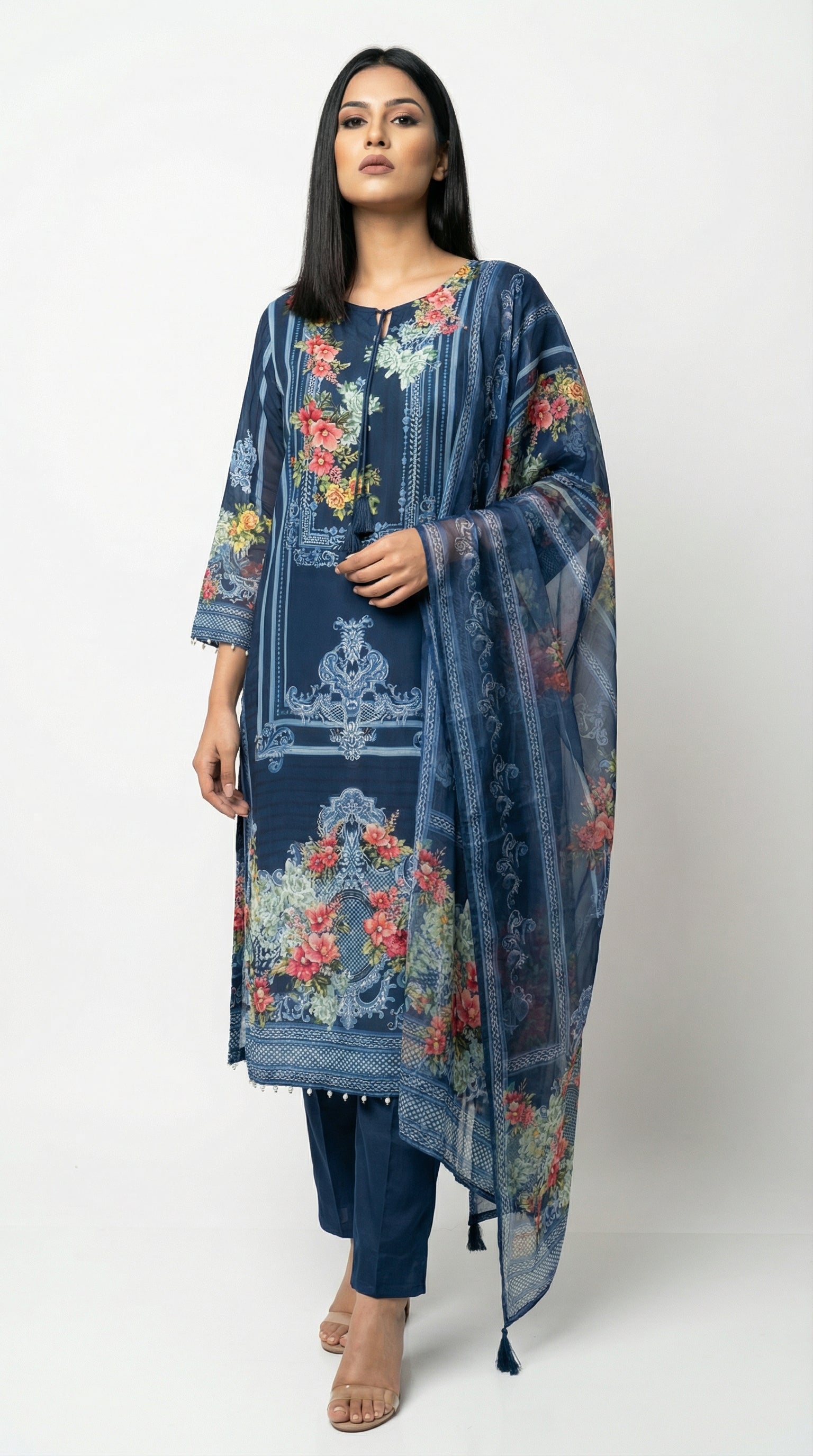 Close-up detail of the round neckline with a keyhole and tassel tie-up on the navy blue floral printed kurta.