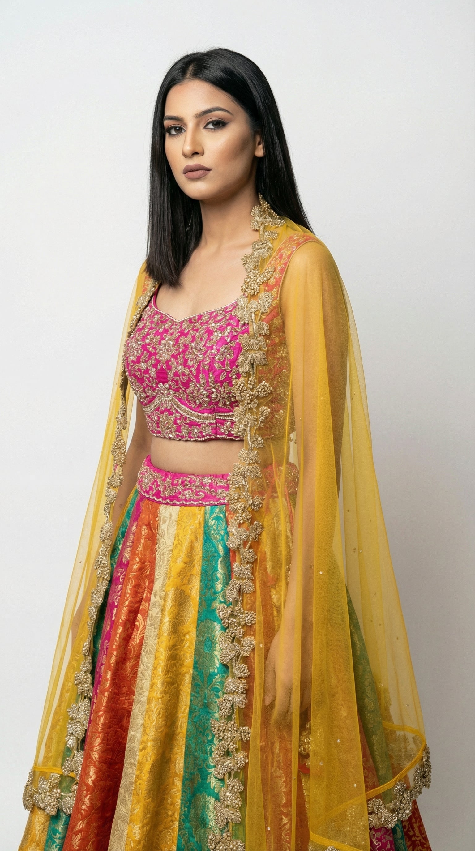 A vibrant pose showing the complete multicolor lehenga look, perfect for a colorful Mehendi or Sangeet ceremony.