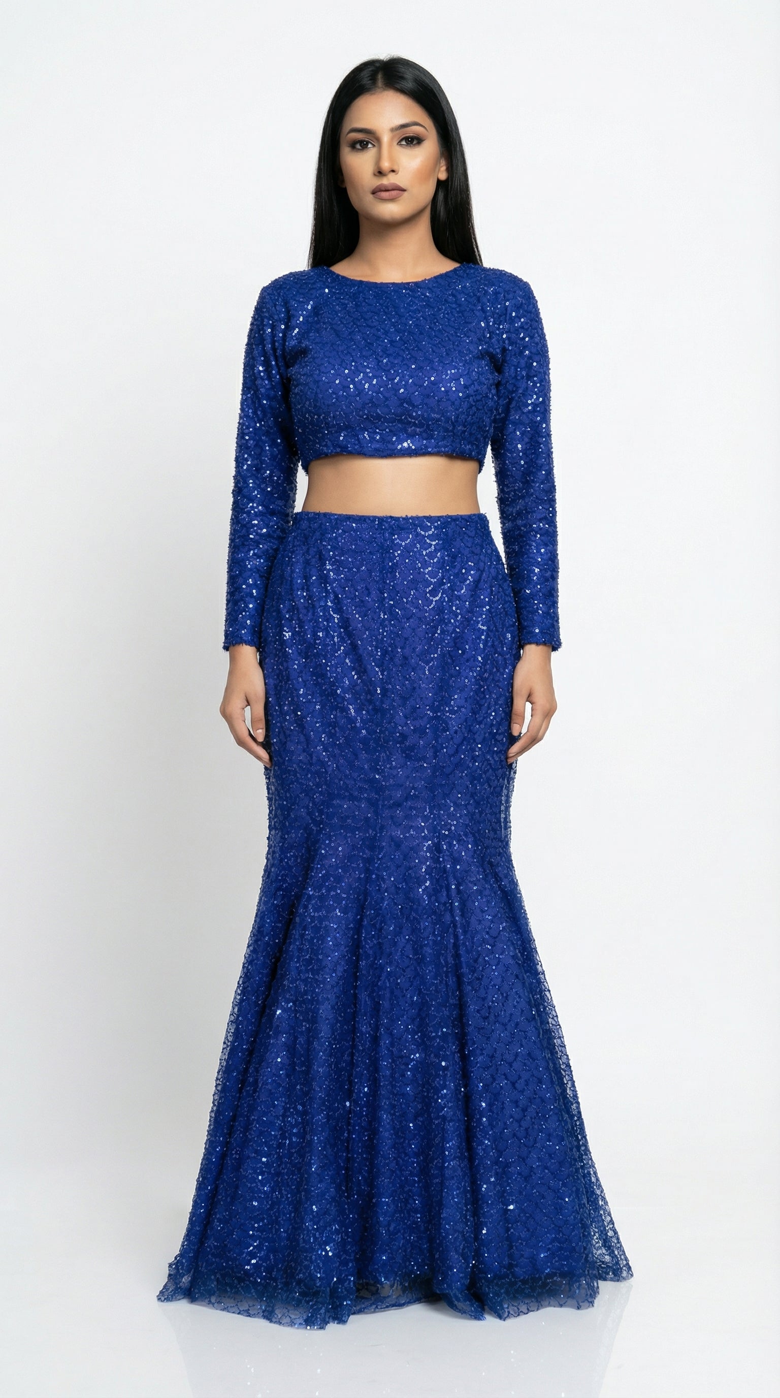 Detail of the fish cut lehenga skirt, highlighting how it hugs the hips and flares at the bottom with heavy sequin work.