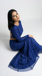 Detail of the fish cut lehenga skirt, highlighting how it hugs the hips and flares at the bottom with heavy sequin work.