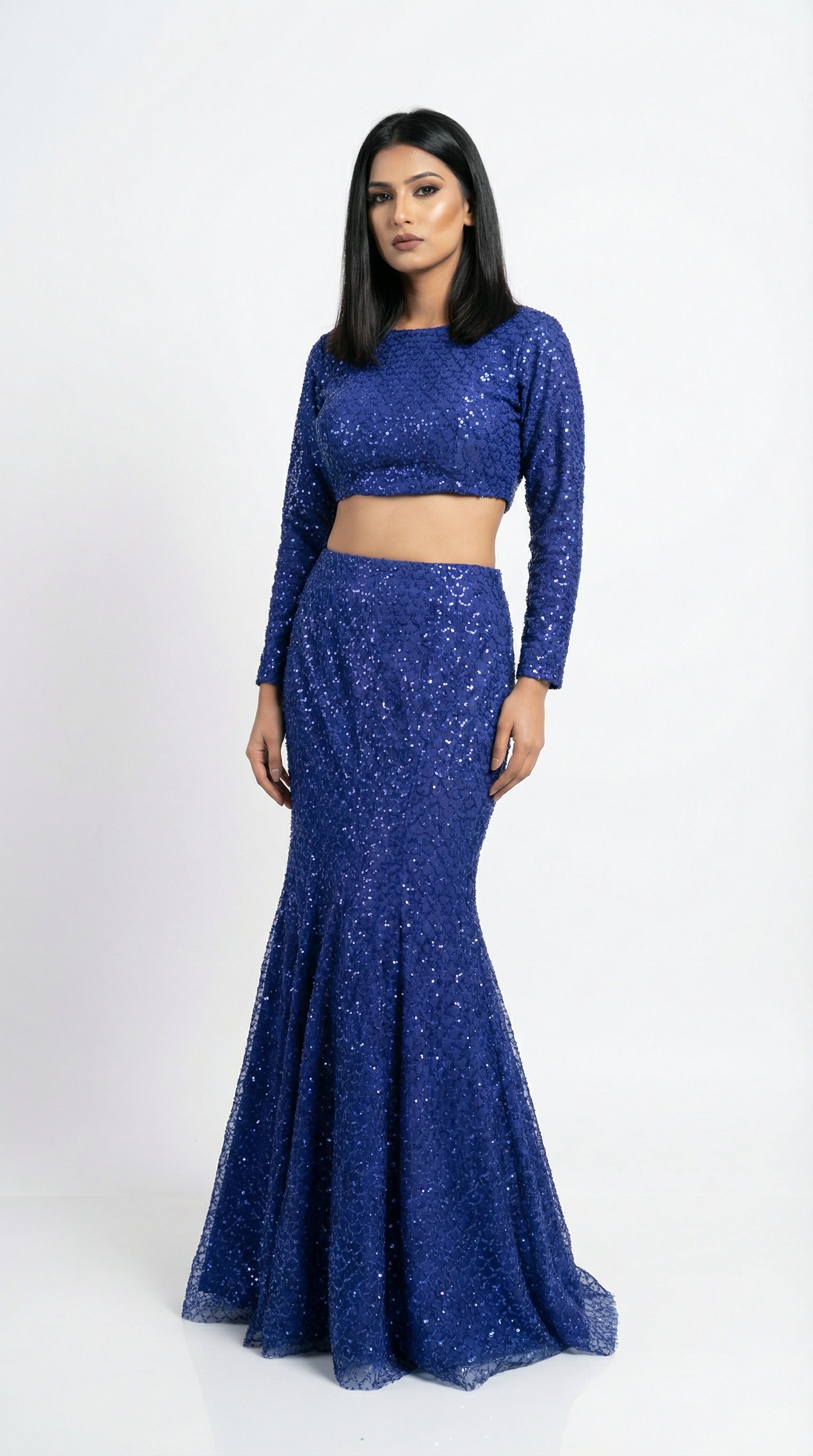 Full body front view of the Rosio House royal blue sequin lehenga featuring a mermaid fish-cut silhouette and long sleeve top.