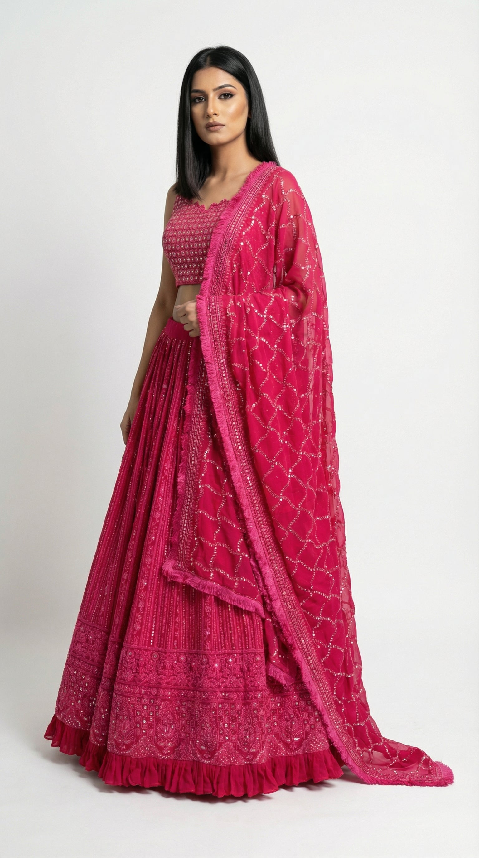 Full body front view of the Rosio House hot pink lehenga featuring intricate Lucknowi chikankari embroidery and sequin work.