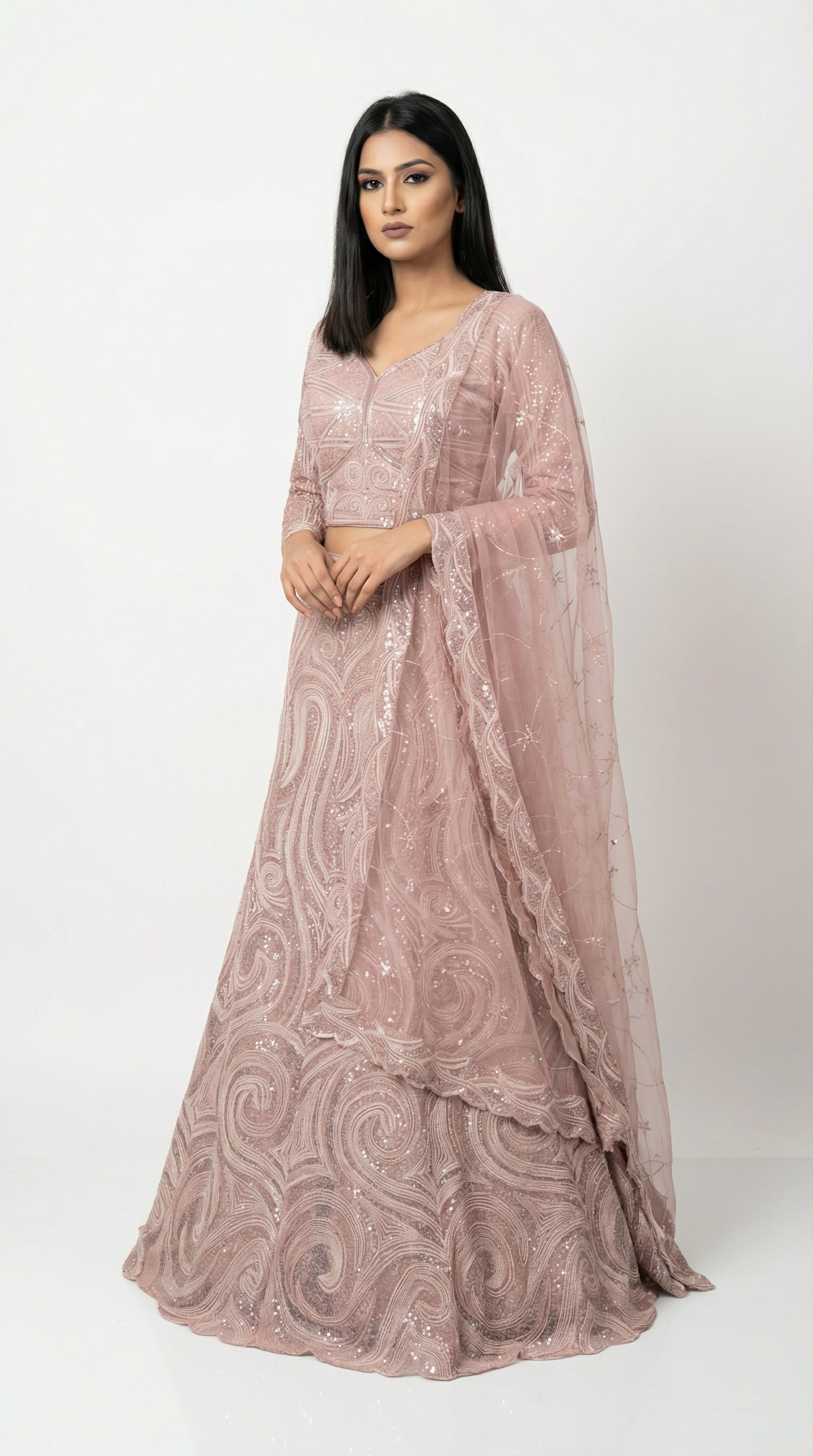 A stylish pose showing the flare and elegance of the monochromatic pink sequin lehenga, perfect for an engagement party.