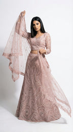 A stylish pose showing the flare and elegance of the monochromatic pink sequin lehenga, perfect for an engagement party.