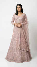 Full body front view of the Rosio House dusty pink lehenga featuring a modern swirl sequin pattern and full-sleeve blouse.