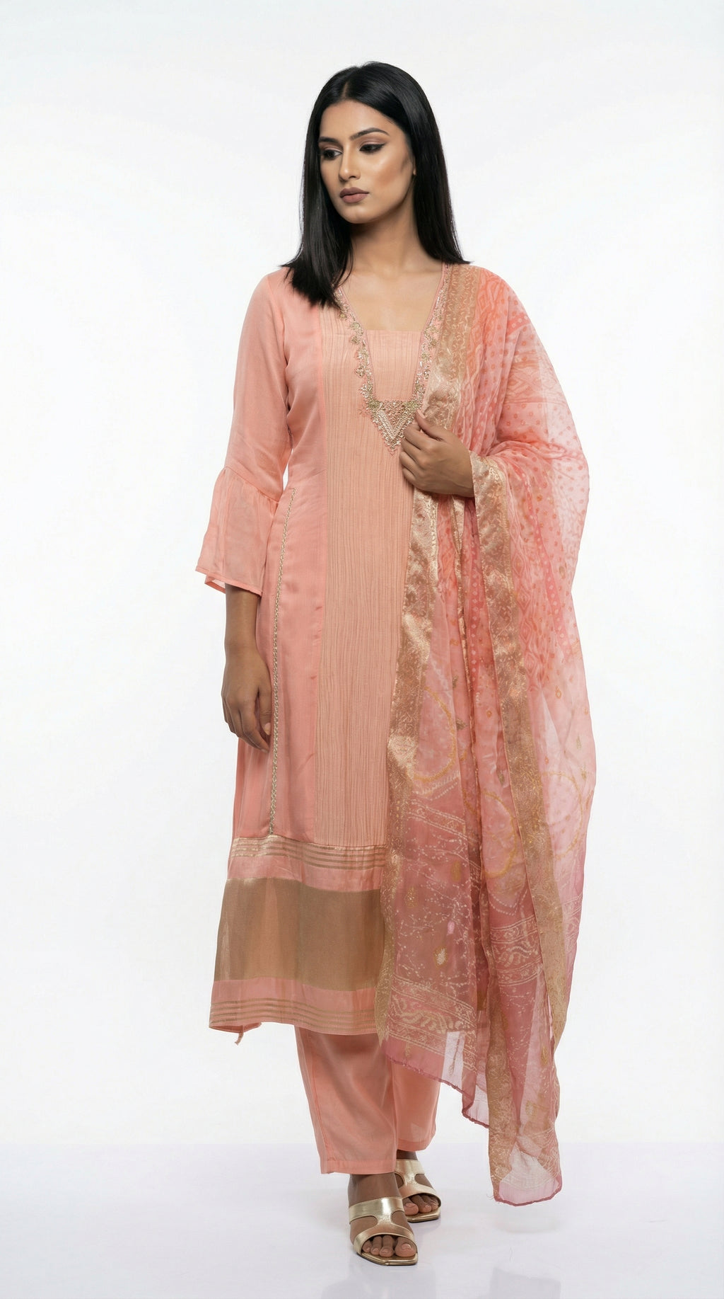 A view of the sheer peach organza dupatta showing the subtle gold foil print and shimmering texture.