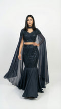 Full body front view of the Rosio House navy blue fish cut lehenga featuring a sequin mermaid skirt and floor-length cape sleeves.