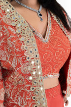 Close-up of the intricate mirror work, gota patti, and thread embroidery on the cropped jacket indo western for women.