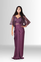 Detailed view of the elegant draping and lustrous satin fabric of the wine-colored pre-stitched skirt from an Indo-Western set.